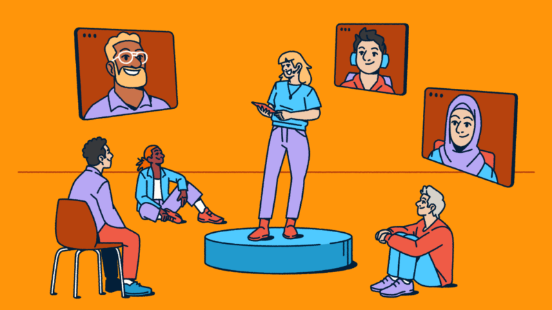 Illustration showing a hybrid meeting in action: a person presents from a circular stage while some attendees sit nearby in-person and others join remotely through video screens. The diverse group highlights how today's conferences blend virtual and in-person experiences to connect everyone regardless of location.
