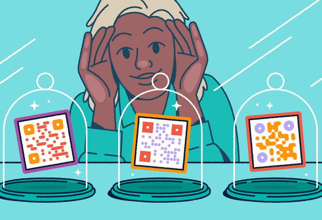 A person looking through a store-front window at three different QR codes on display in glass cloches.